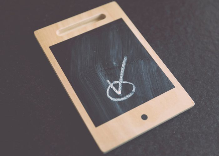 Wooden ipad with check mark