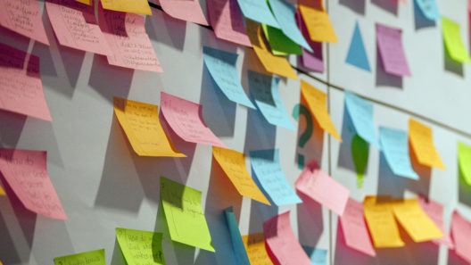 Multi-coloured post-it notes on a wall