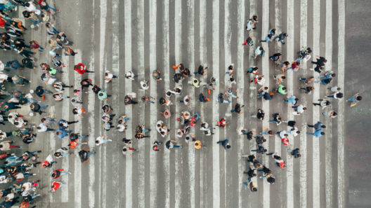 High Angle View Of People forming and arrow on the street