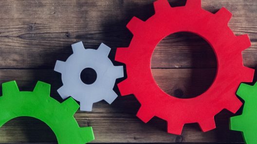 A series of interlocking cogs on a table