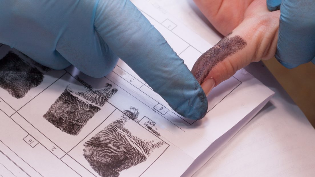 Fingerprint collection by border control authorities.